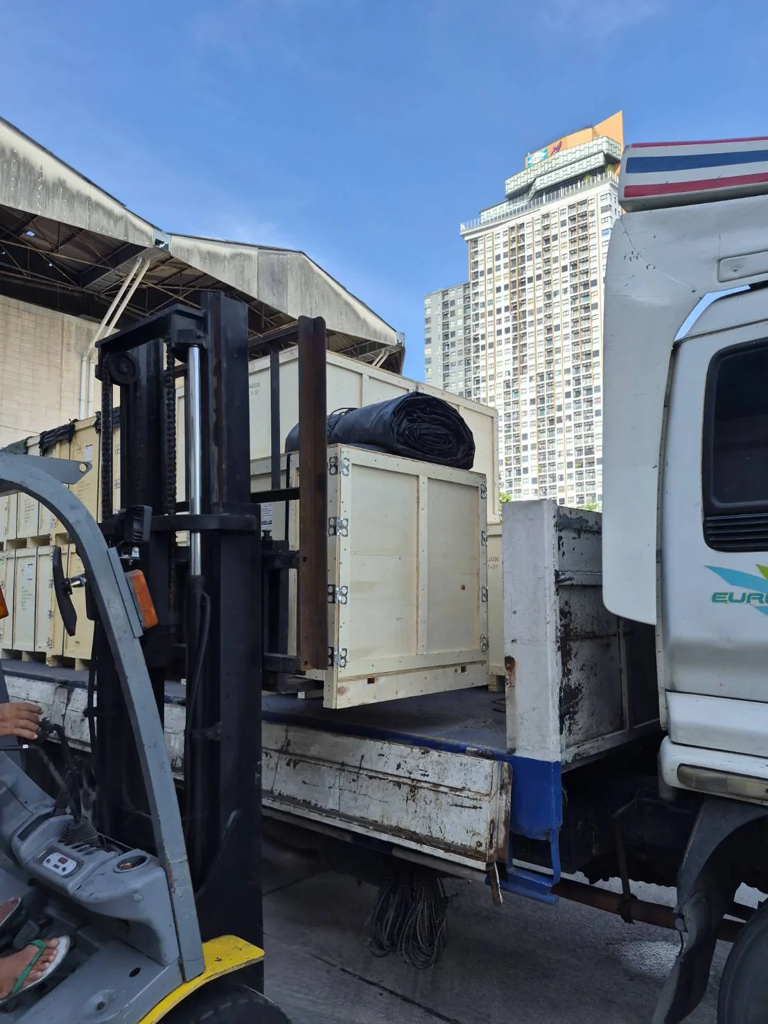MPC specialist overseeing warehouse storage of Bangkok-marked industrial chain crates ready for dispatch